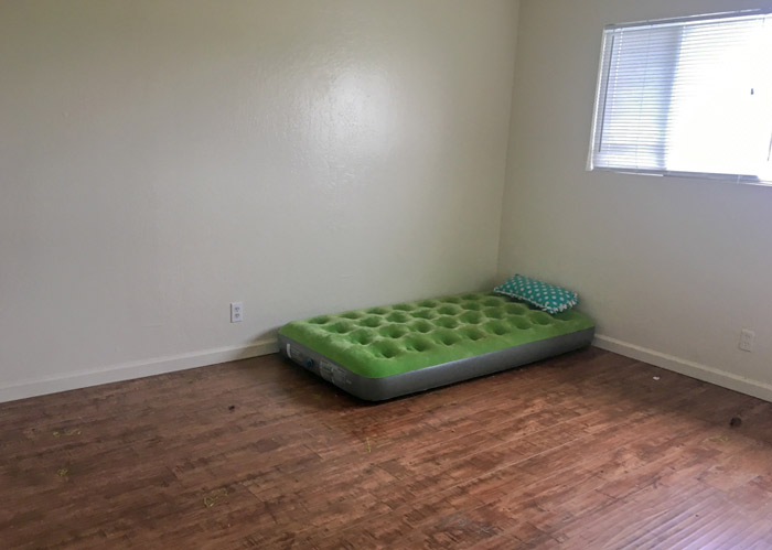 A twin-air mattress on the floor.