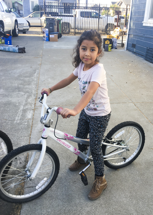 Little girl on her bike