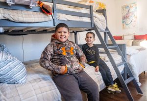 Kids sitting on bunk bed